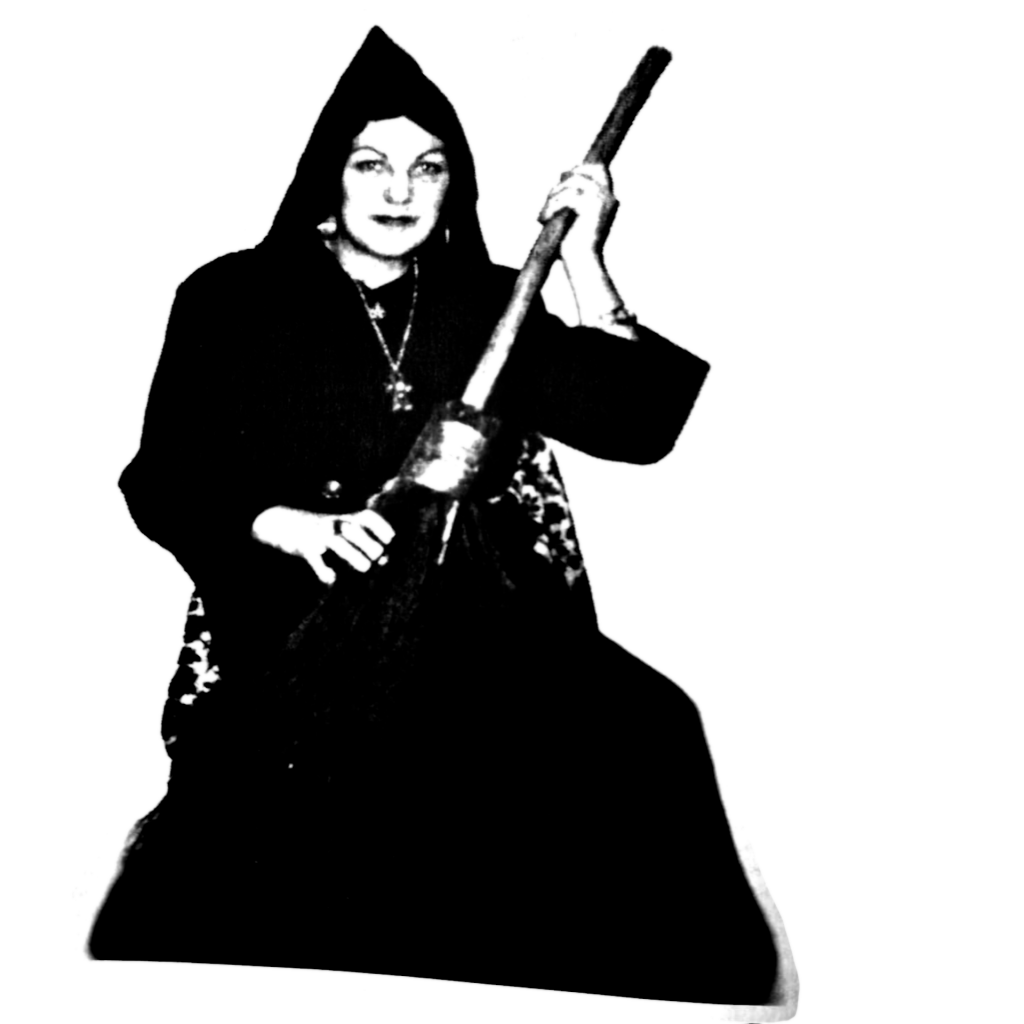 Doreen-Valiente-in-black-robe-with-broom-from-pagan-dawn-magazine-interveiw
