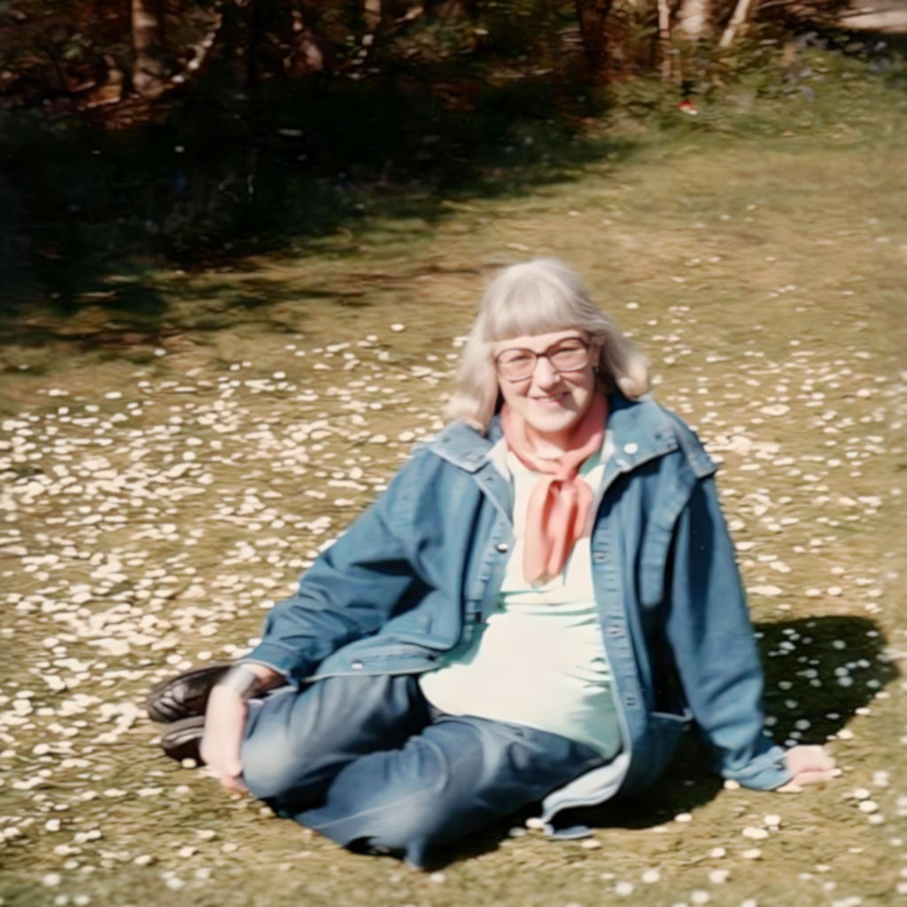 Doreen-in-denim-jacket-sat-outside-on-grass