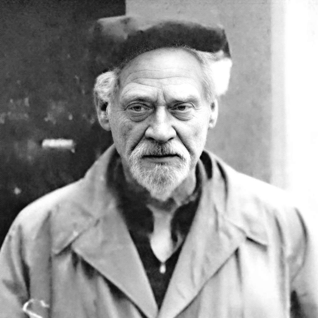 Gerald Gardner Black and white image, of him wearing coat and hat