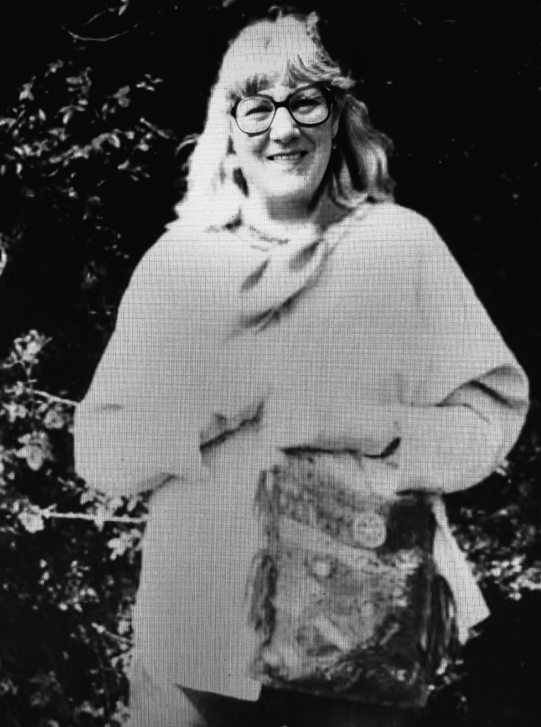 Doreen-V-holding-bag-outdoors-black-and-white