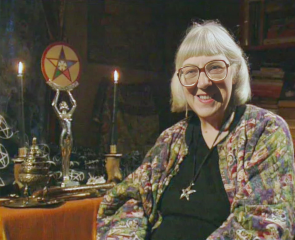 Doreen-being-interviewed-in-front-of-ritual-tools
