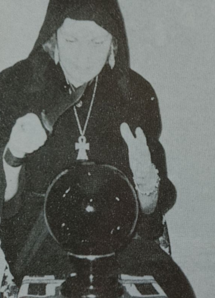 Doreen-in-robe-with-crystal-ball-and-athame