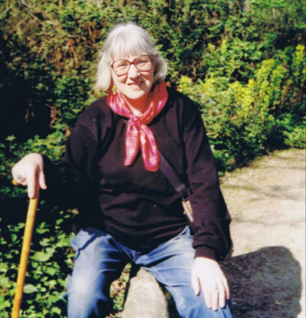 Doreen-sat-on-Gardner-wall-with-walking-stick