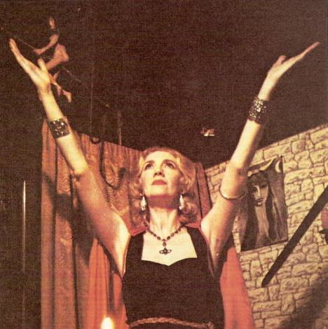 Patricia invoking iwth arms raised